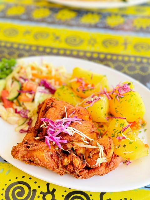 Fried fish with potatoes and salad