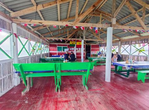 The island dining area with tables and benches